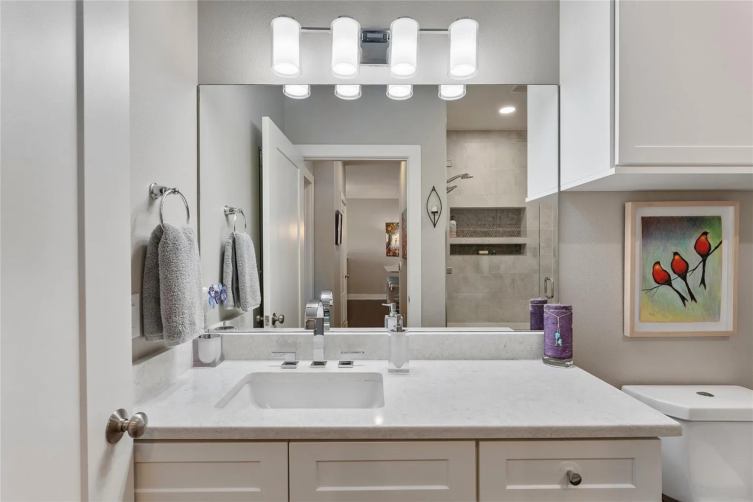 908 Nueces Street, Unit 31 Austin, TX 78701 - Photo 23 of 32 a bathroom with a sink vanity and a mirror