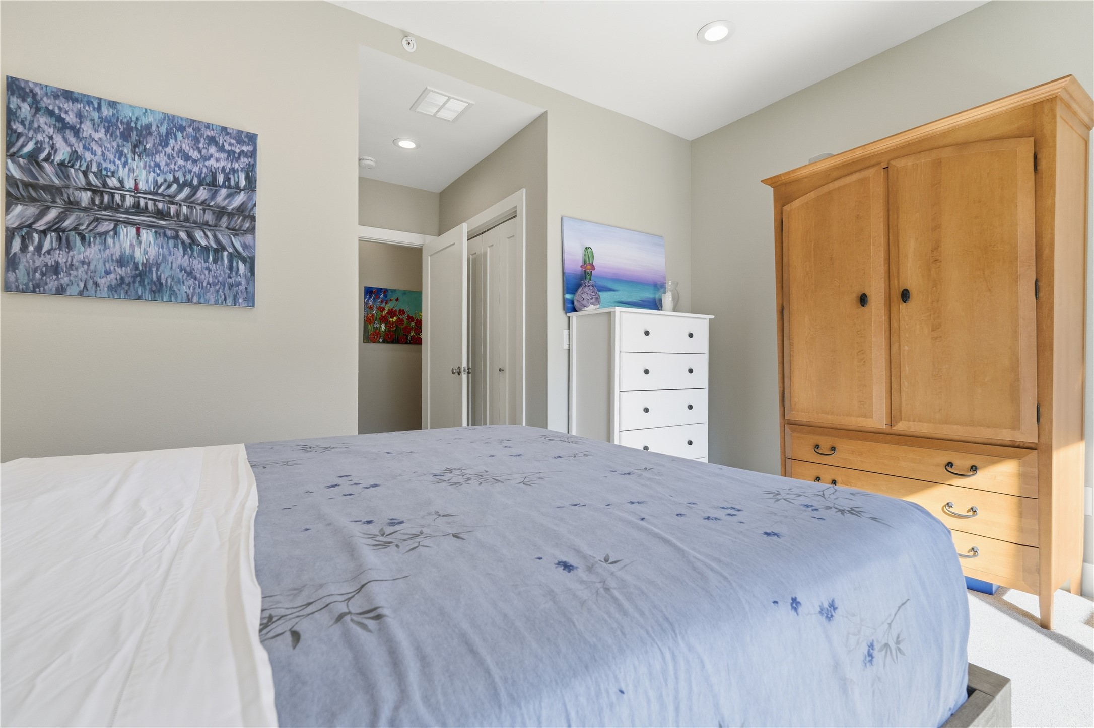 908 Nueces Street, Unit 31 Austin, TX 78701 - Photo 24 of 32 a bedroom with a bed and cabinets