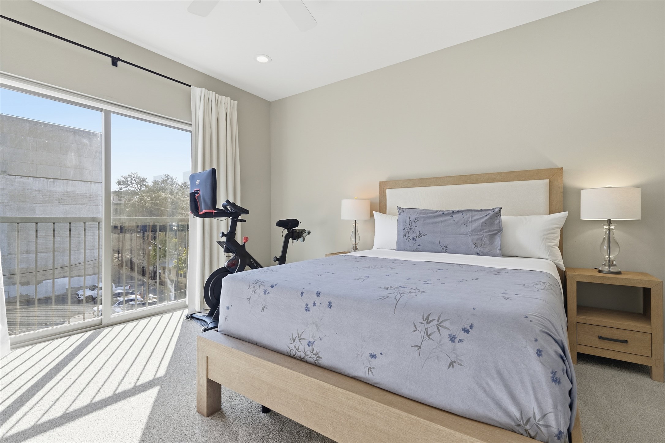 908 Nueces Street, Unit 31 Austin, TX 78701 - Photo 25 of 32 a bedroom with a bed and a large window