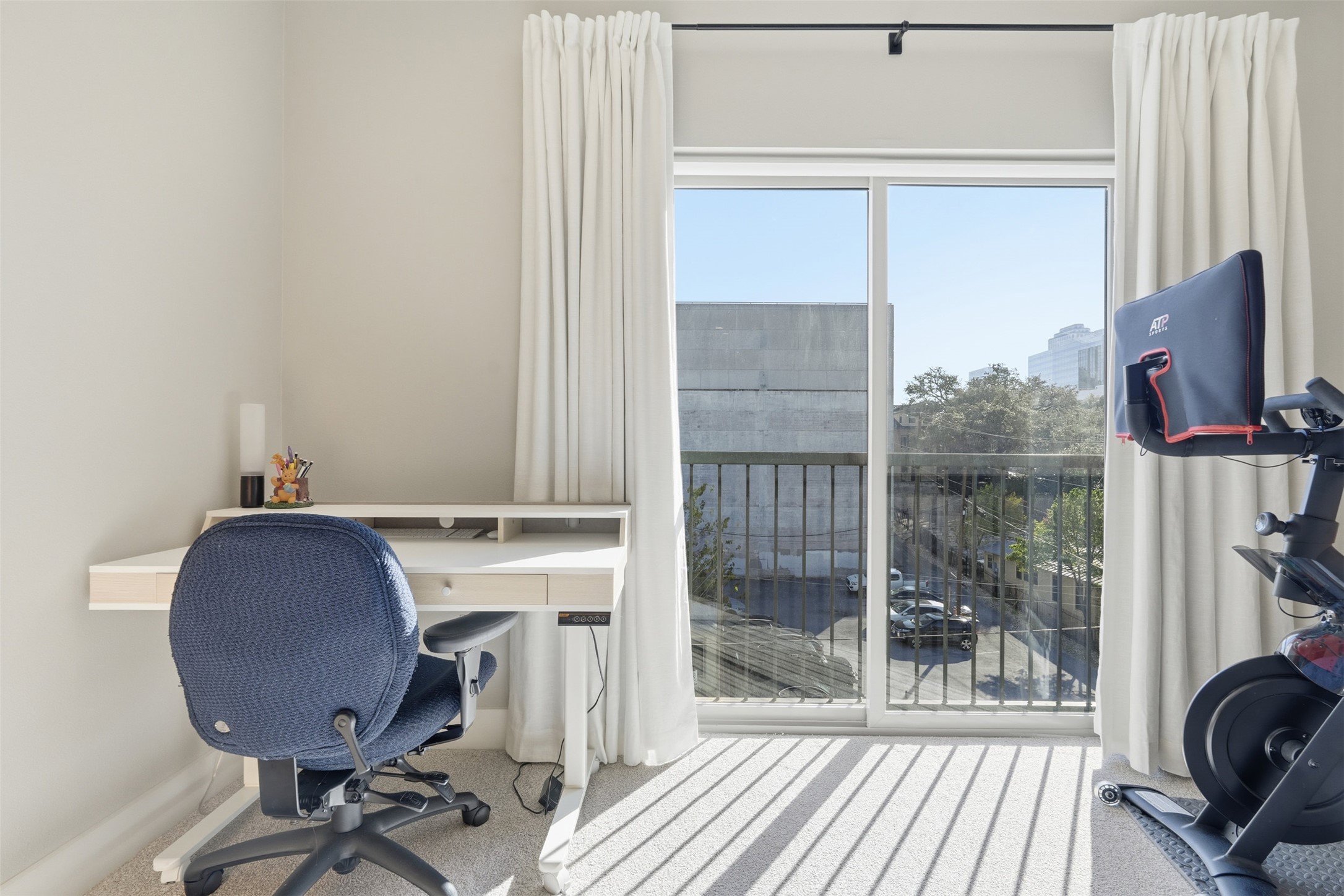 908 Nueces Street, Unit 31 Austin, TX 78701 - Photo 9 of 32 a workspace with furniture and a window