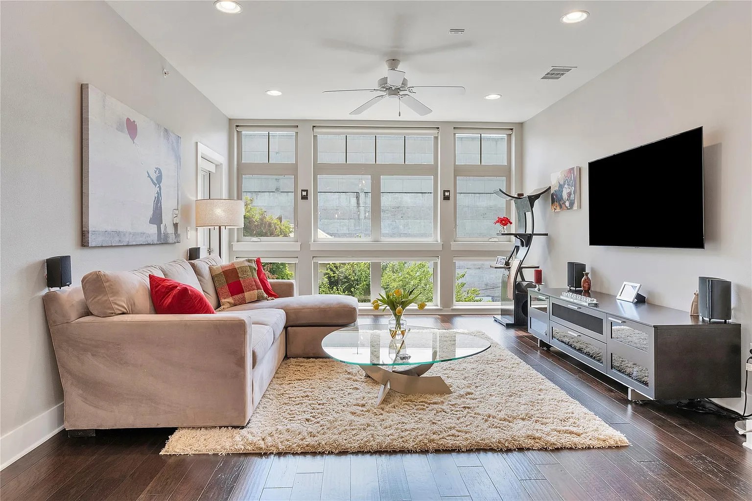 908 Nueces Street, Unit 31 Austin, TX 78701 - Photo 10 of 32 a living room with furniture and a flat screen tv