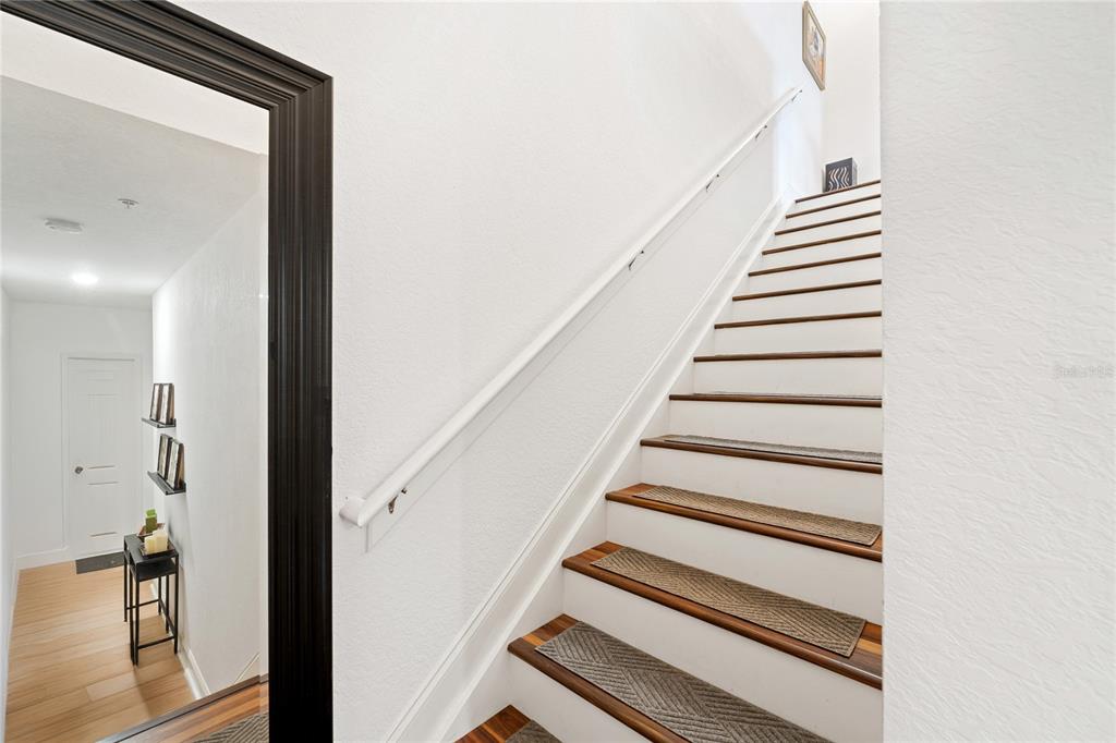 1819 Common Way Road, Unit 203 Orlando, FL 32814 - Photo 5 of 23 a view of entryway and hall with wooden floor
