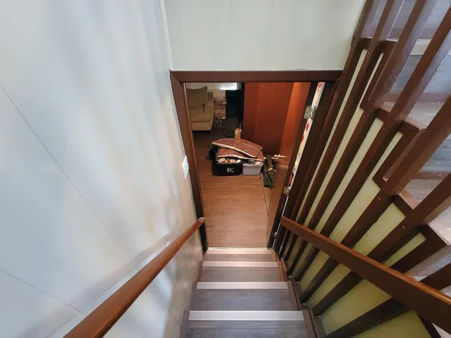 a bed room with furniture and a window