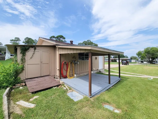 a view of a house with a yard and garage