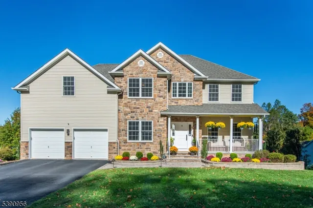 a front view of house with yard and outdoor seating