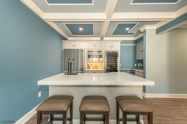 a kitchen with a sink appliances and cabinets