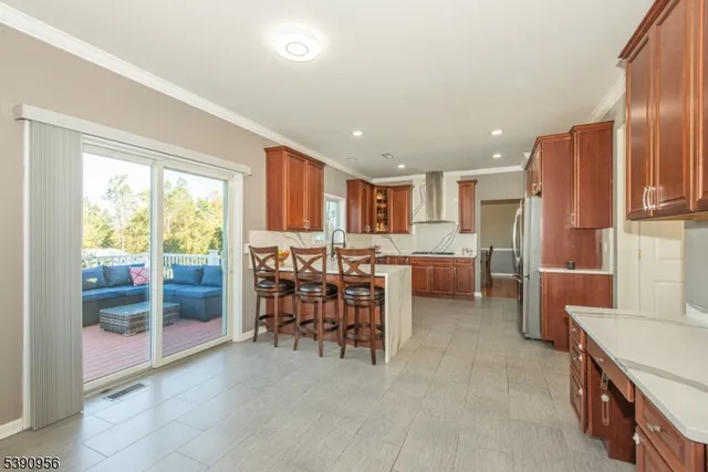 a kitchen with stainless steel appliances a refrigerator and microwave