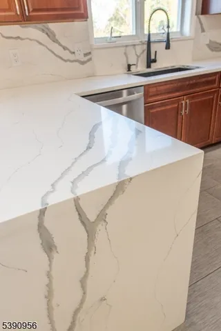 a kitchen with a table chairs refrigerator and microwave