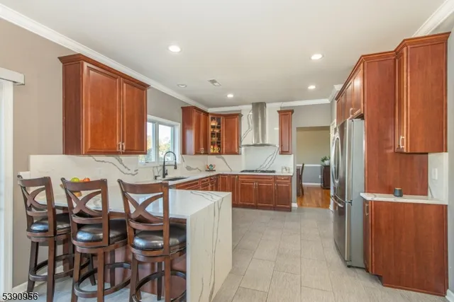 a large kitchen with lots of counter and sink