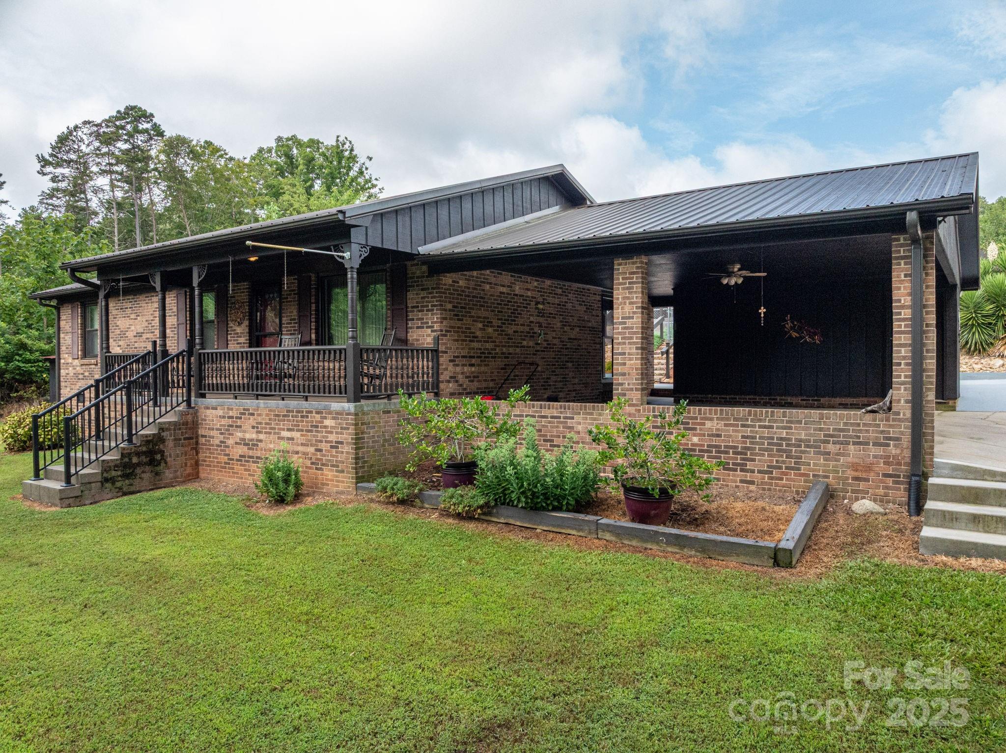 a front view of a house with garden
