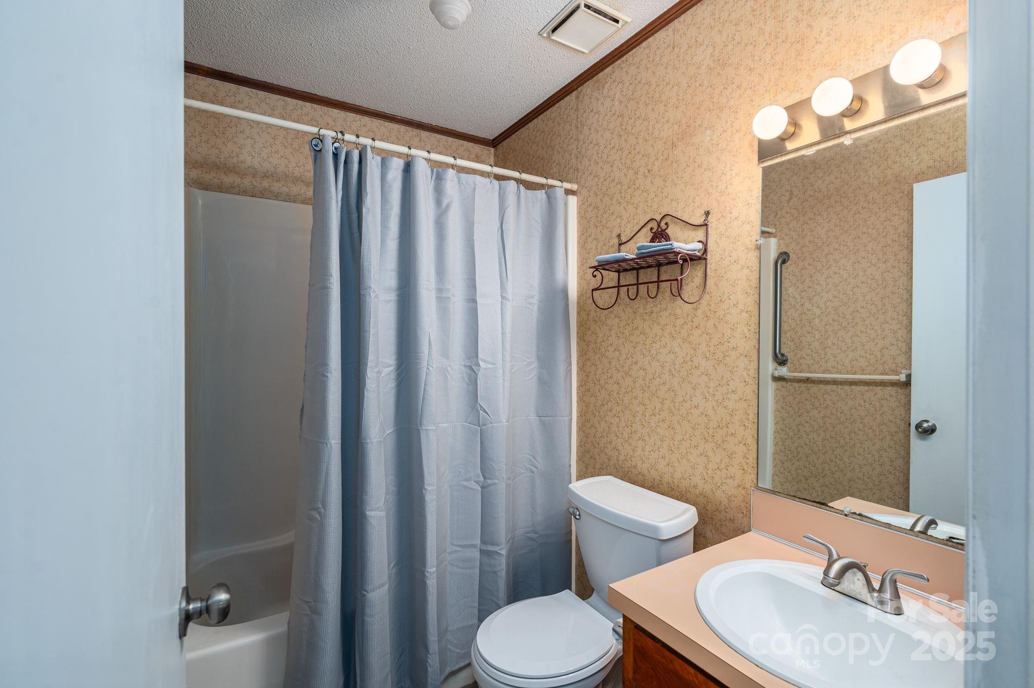 3076 Gates Road Lincolnton, NC 28092 - Photo 15 of 36 a bathroom with a sink toilet and shower