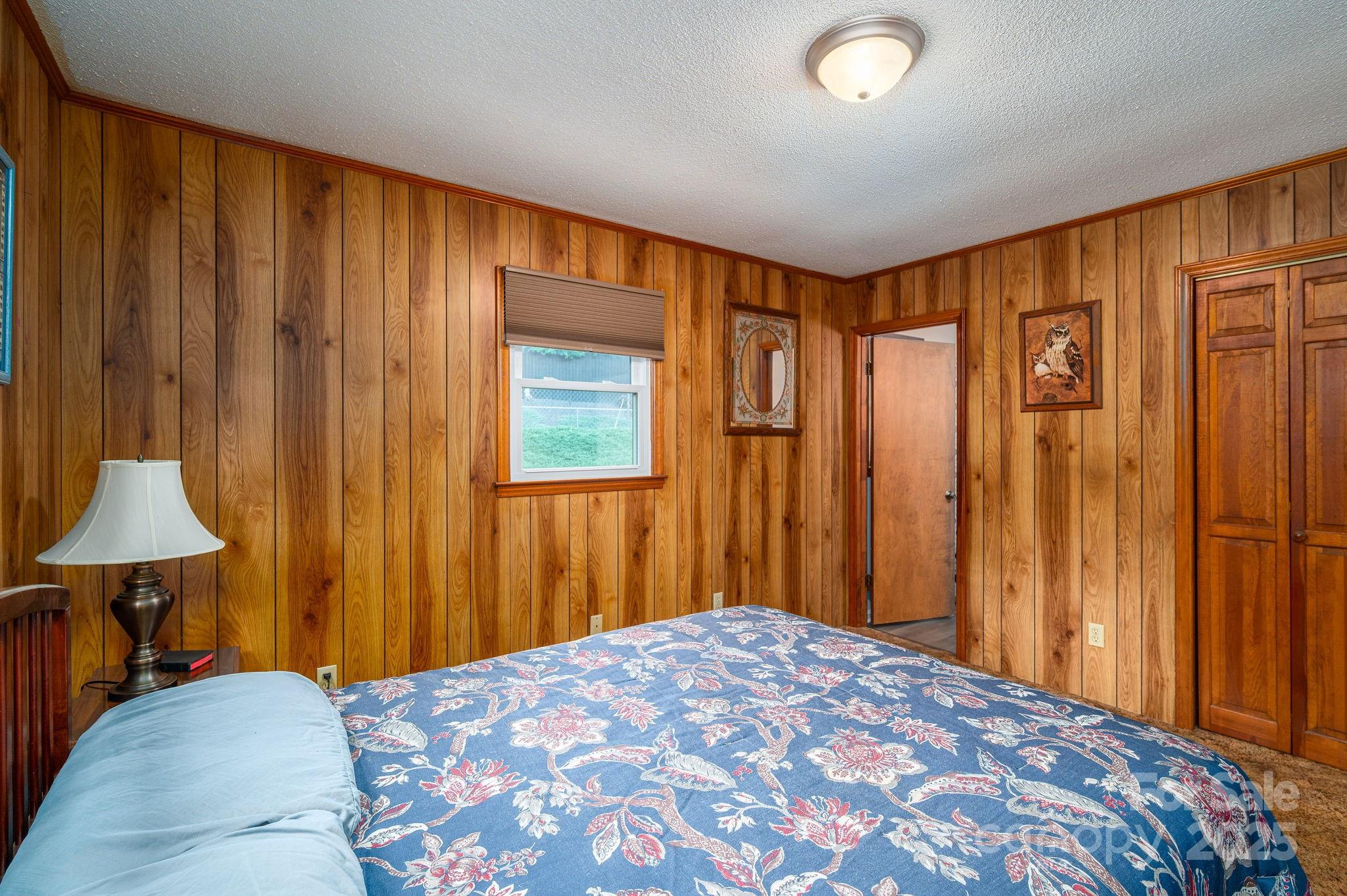 3076 Gates Road Lincolnton, NC 28092 - Photo 17 of 36 a bedroom with a bed and a lamp on table