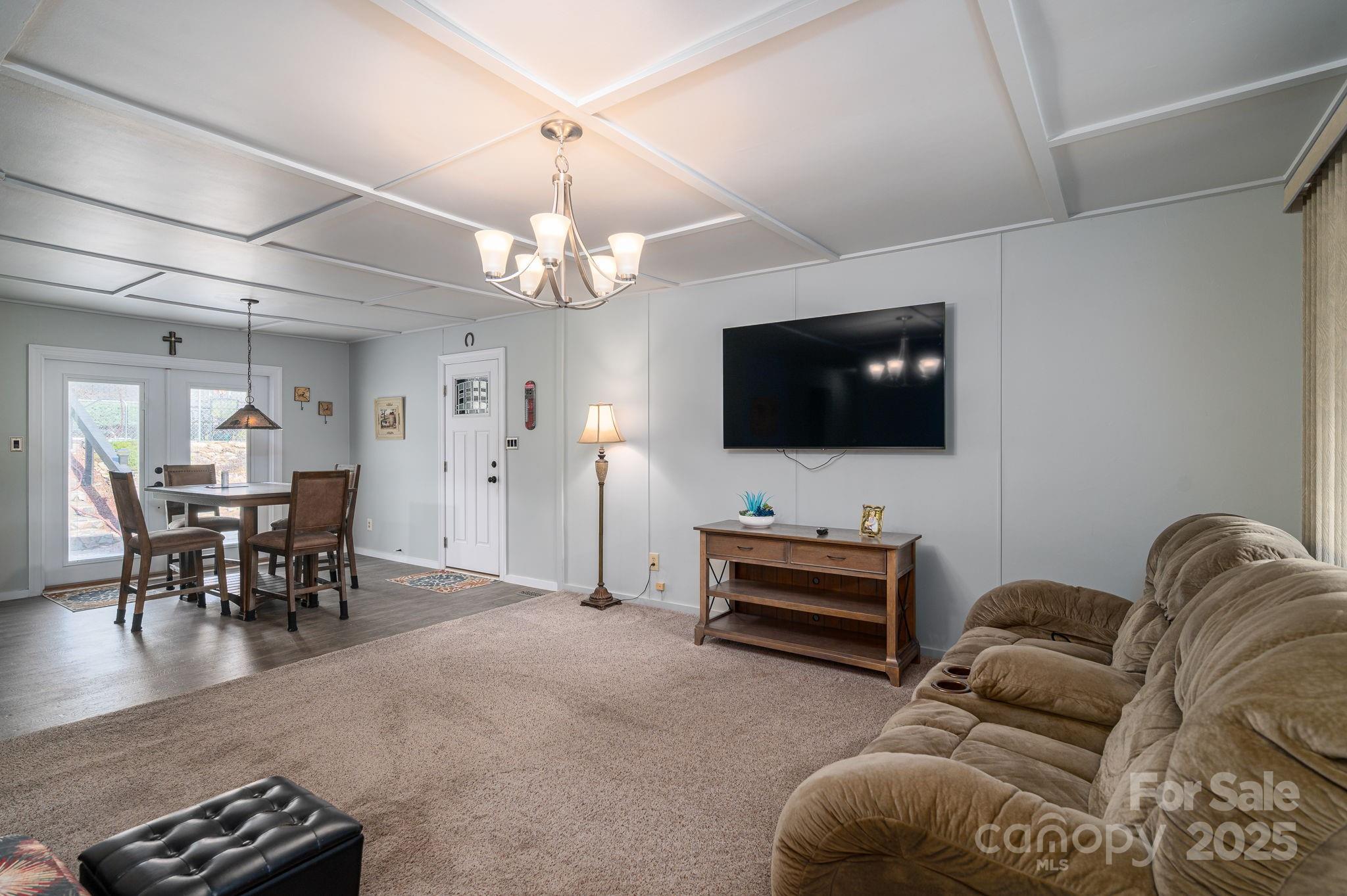 3076 Gates Road Lincolnton, NC 28092 - Photo 3 of 36 a living room with furniture and a flat screen tv