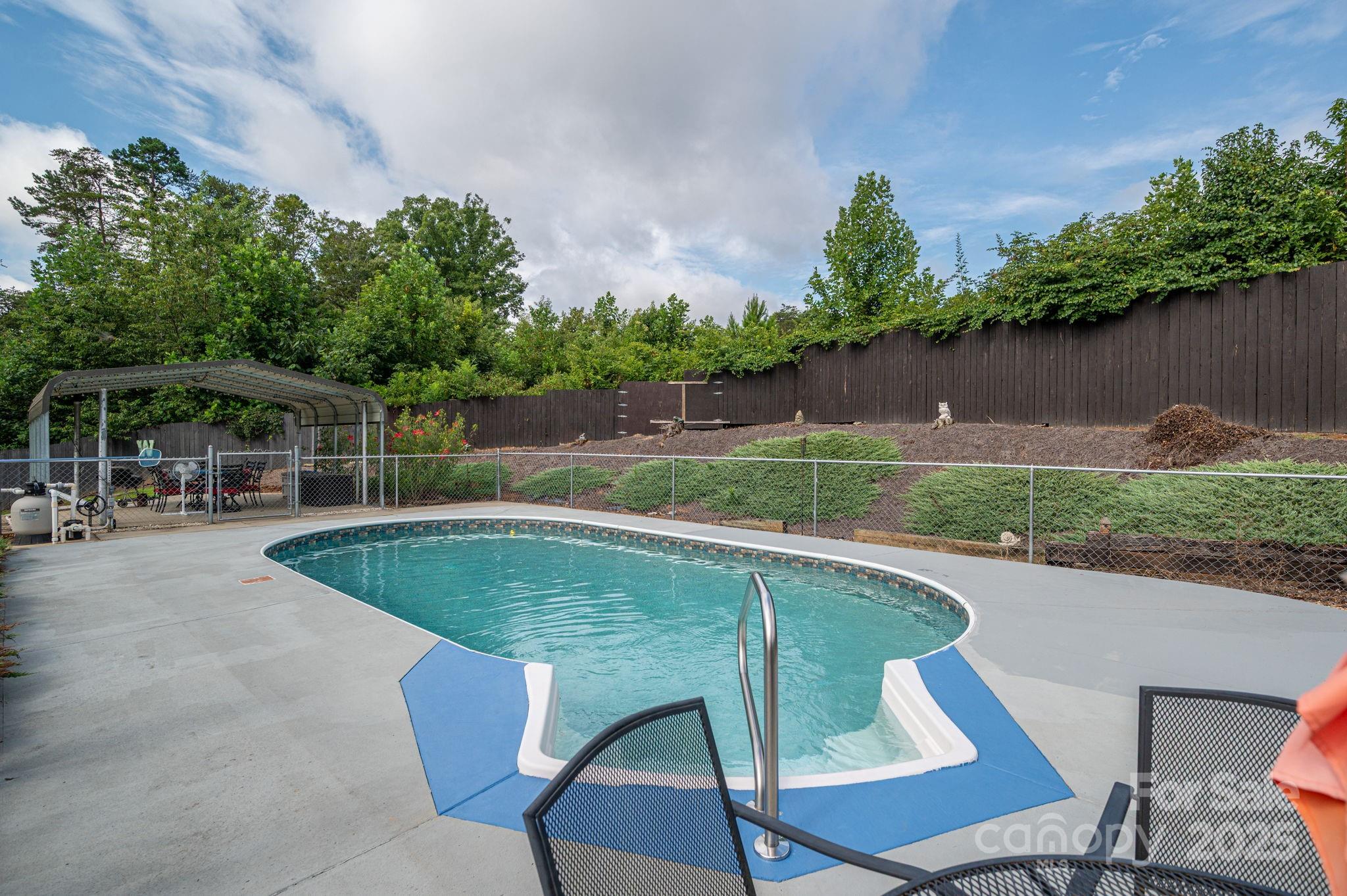 3076 Gates Road Lincolnton, NC 28092 - Photo 32 of 36 a view of a swimming pool with a patio