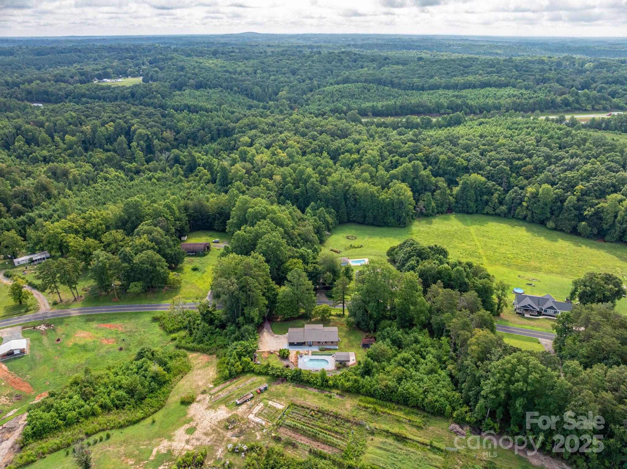 3076 Gates Road Lincolnton, NC 28092 - Photo 36 of 36 a view of a lush green forest with lots of trees