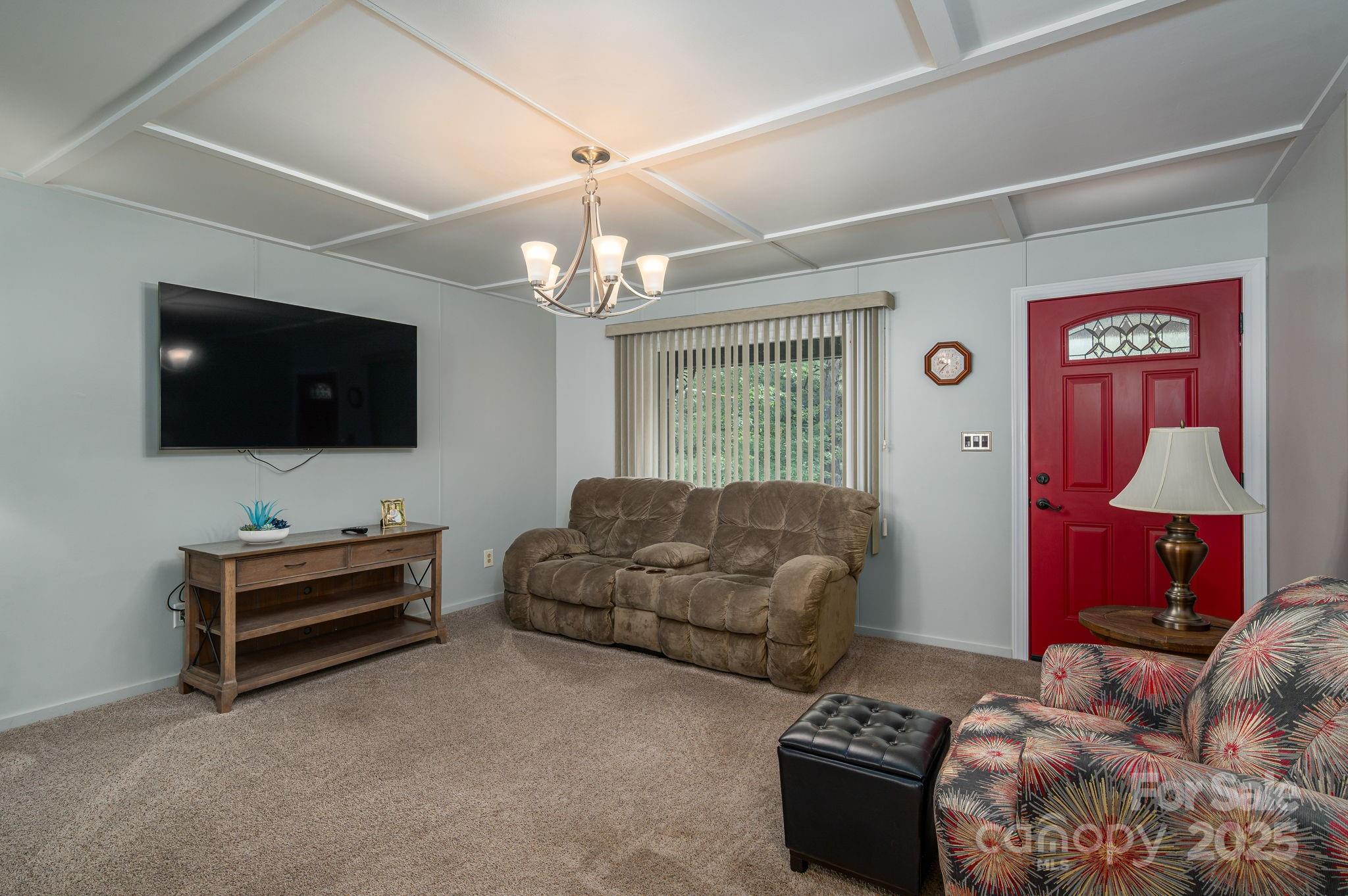 3076 Gates Road Lincolnton, NC 28092 - Photo 5 of 36 a bedroom with furniture and a flat screen tv