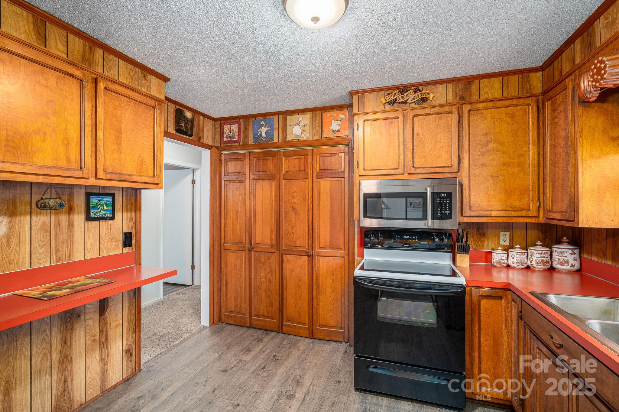 3076 Gates Road Lincolnton, NC 28092 - Photo 10 of 36 a kitchen with stainless steel appliances granite countertop a microwave a stove and a refrigerator