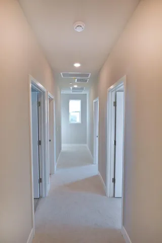 a view of hallway with livingroom