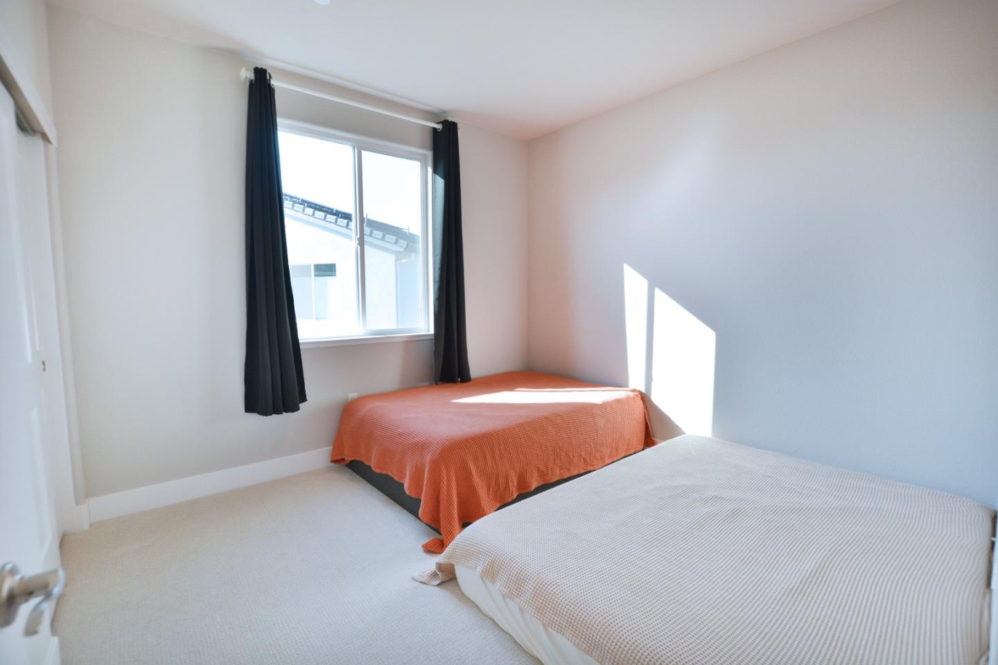 809 Big Range Way Rocklin, CA 95765 - Photo 19 of 31 a bedroom with two beds and a window