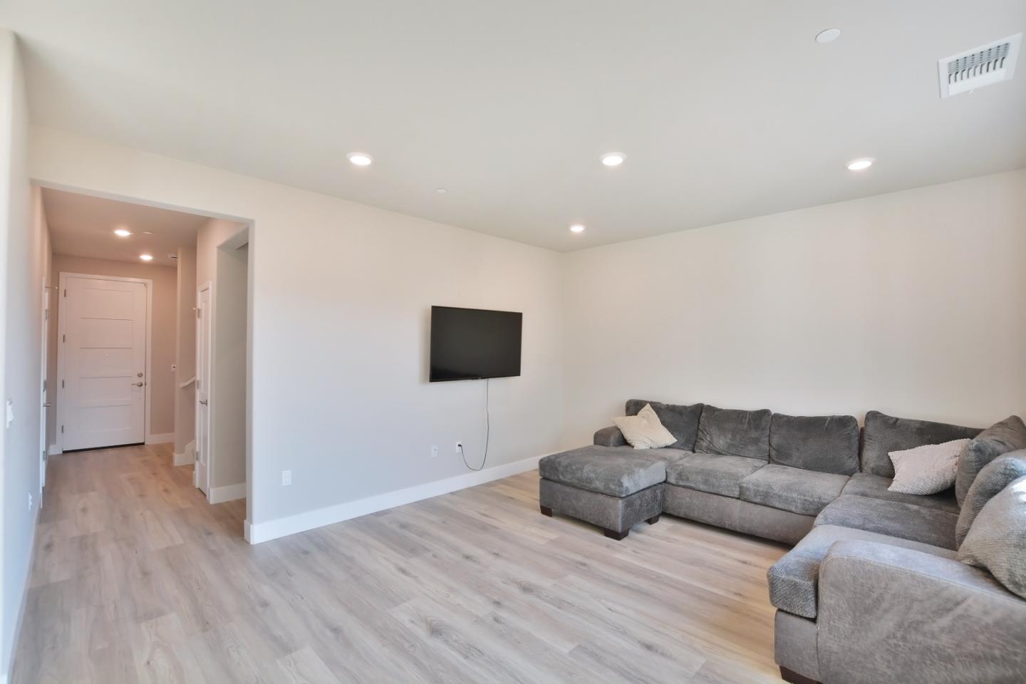 809 Big Range Way Rocklin, CA 95765 - Photo 4 of 31 a living room with furniture and a flat screen tv