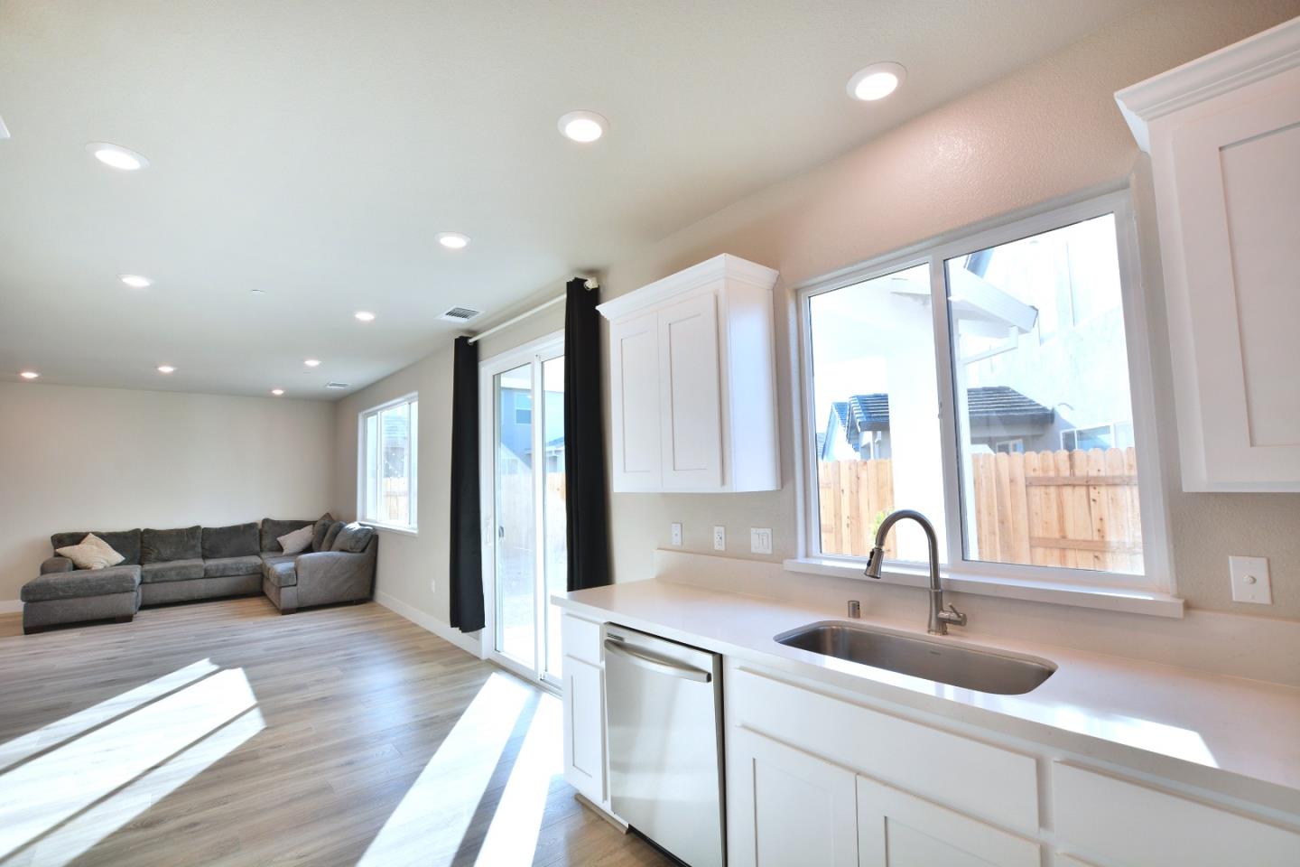 809 Big Range Way Rocklin, CA 95765 - Photo 6 of 31 a large kitchen with stainless steel appliances a large window in it