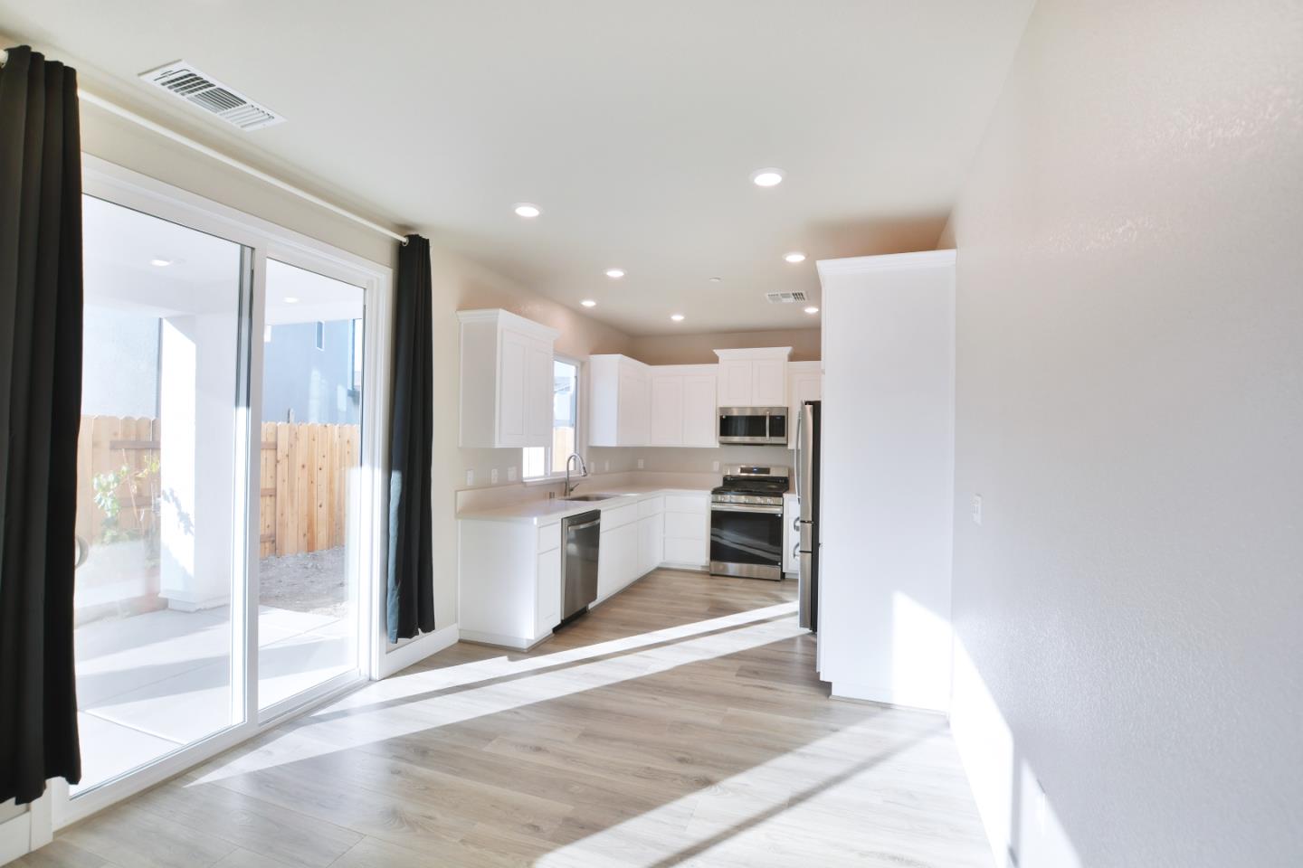 809 Big Range Way Rocklin, CA 95765 - Photo 8 of 31 a view of a kitchen with a refrigerator and a sink