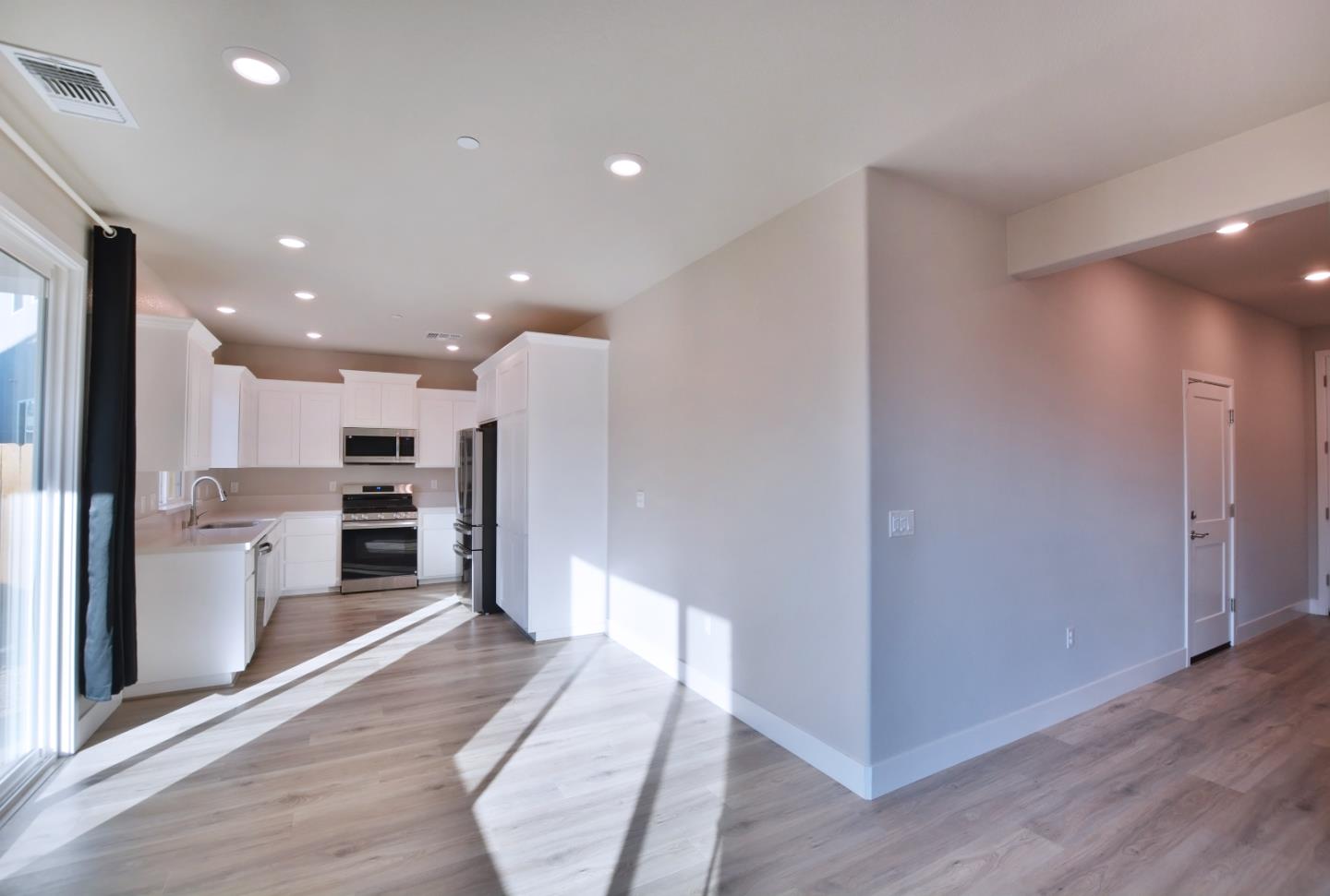 809 Big Range Way Rocklin, CA 95765 - Photo 10 of 31 a view of a kitchen with a sink and a refrigerator