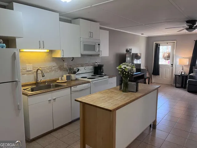 a kitchen with a sink and cabinets