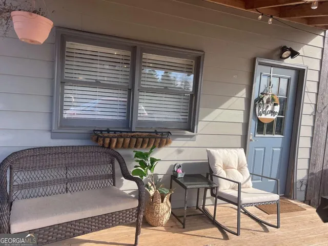 a balcony view with a seating space