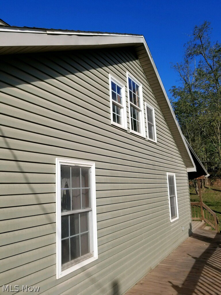29 Fall Run Road Walker, WV 26180 - Photo 32 of 35 Side view of porch just below master suite