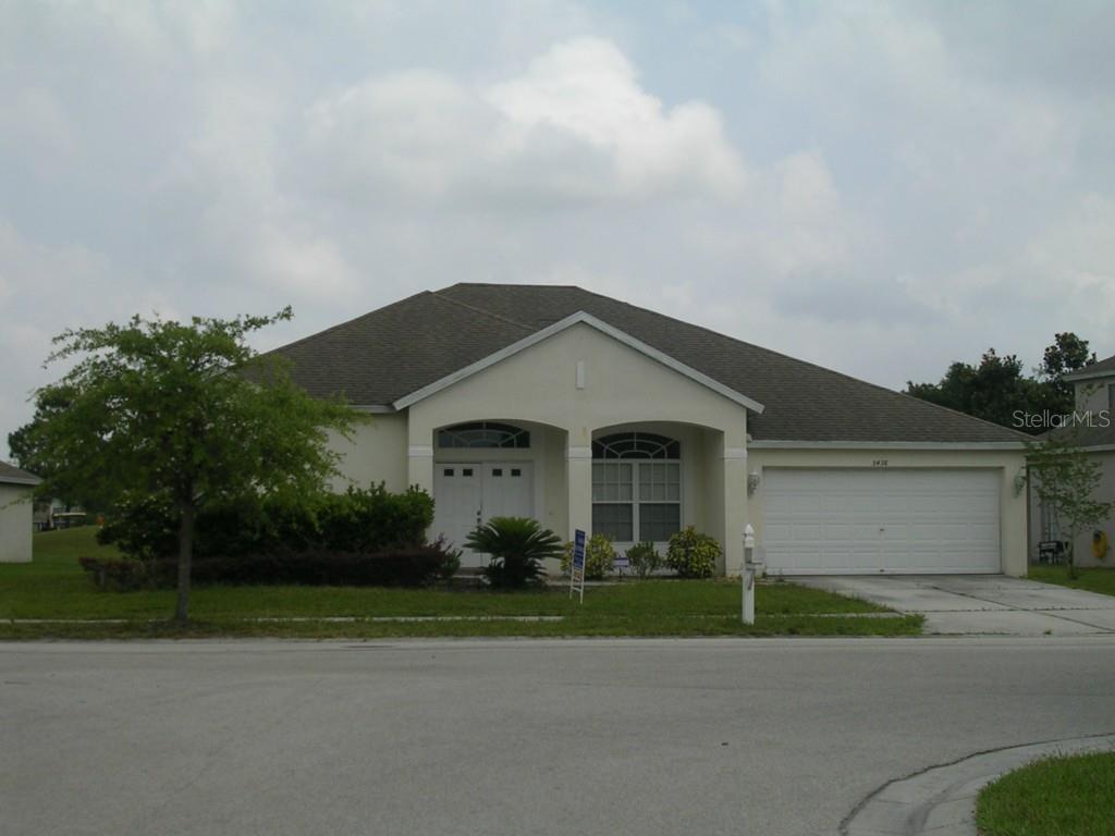 5438 Riva Ridge Drive Wesley Chapel, FL 33544 - Photo 1 of 1 a front view of a house with a yard and garage