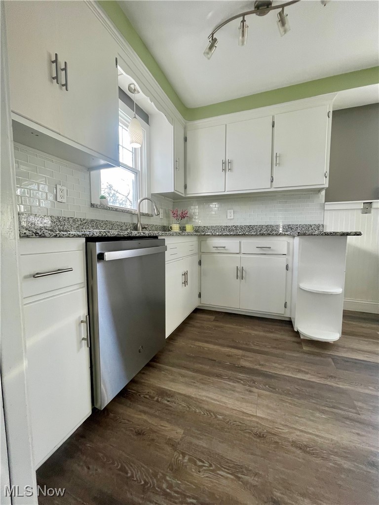 1544 Edgefield Road Lyndhurst, OH 44124 - Photo 6 of 36 Kitchen featuring white cabinetry, light stone counters, dark wood-style floors, and stainless steel dishwasher