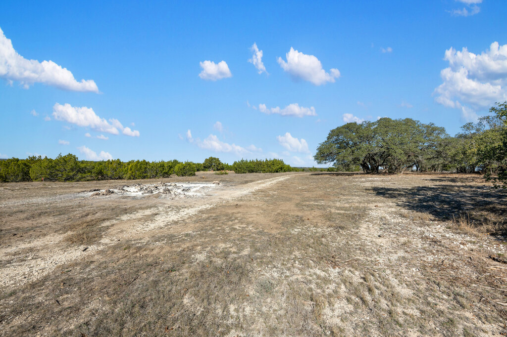 202 Whispering Wind Road Bertram, TX 78605 - Photo 9 of 11 a view of a lake