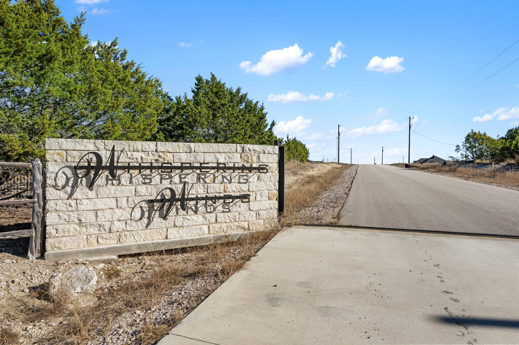 202 Whispering Wind Road Bertram, TX 78605 - Photo 10 of 11 a view of outdoor space with sign board