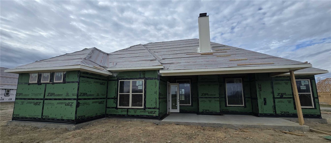 7020 Skipping Rock Path Bryan, TX 77808 - Photo 17 of 19 a front view of a house with a garden