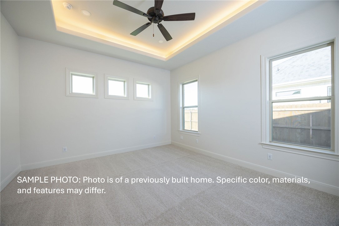 7020 Skipping Rock Path Bryan, TX 77808 - Photo 6 of 19 a view of a big room with windows and chandelier fan