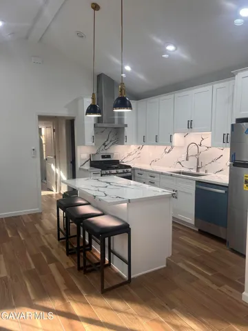 a kitchen with a table and chairs in it