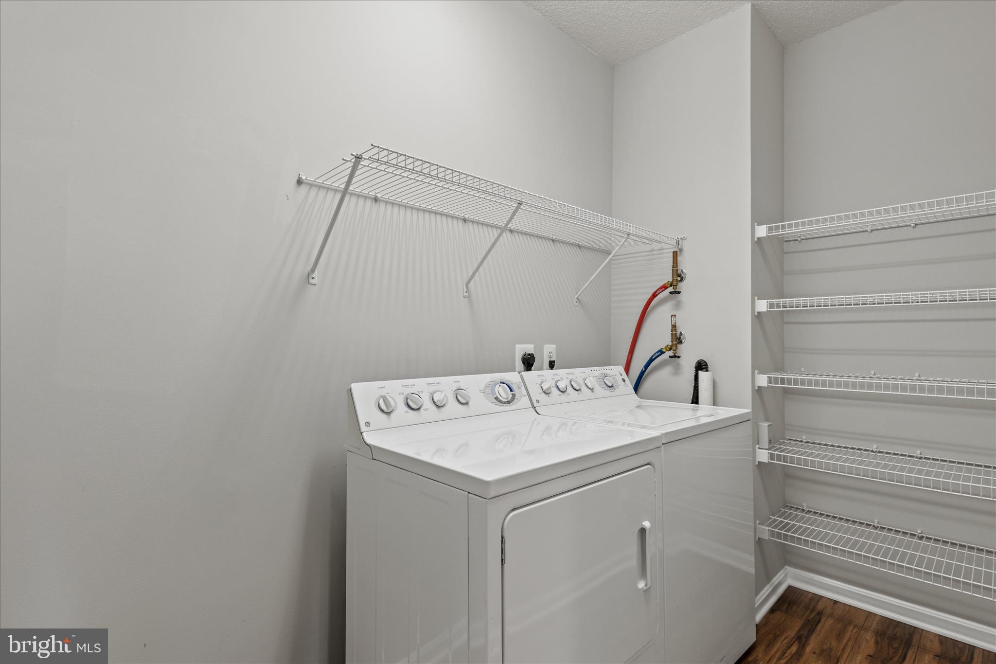 19355 Cypress Ridge Terrace, Unit 612 Leesburg, VA 20176 - Photo 32 of 65 a utility room with dryer and washer