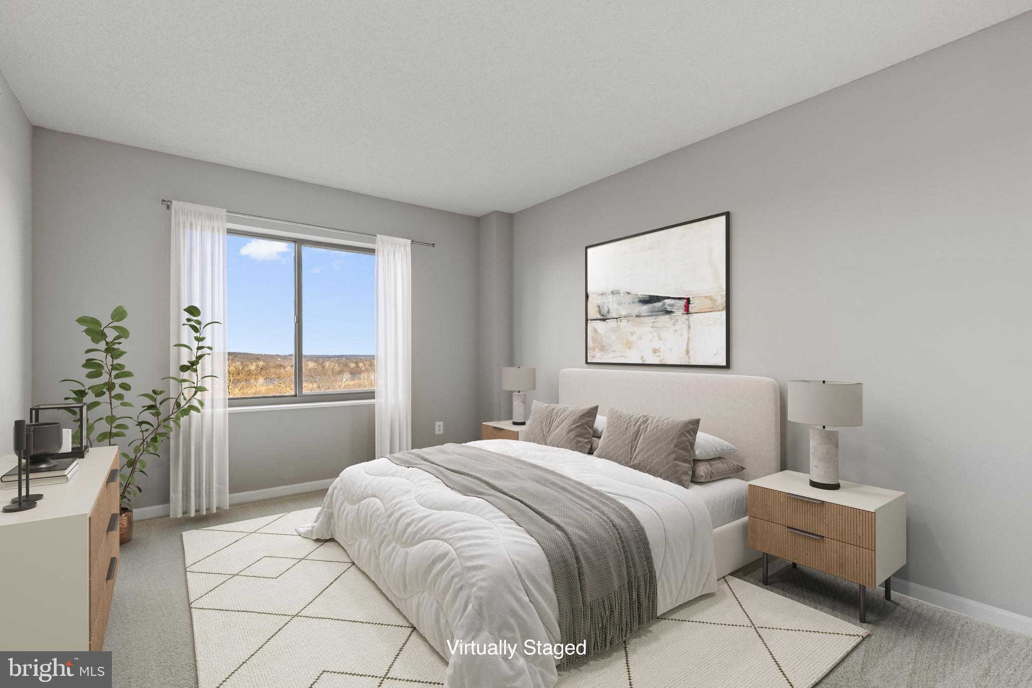 19355 Cypress Ridge Terrace, Unit 612 Leesburg, VA 20176 - Photo 33 of 65 a bedroom with a large bed and a window