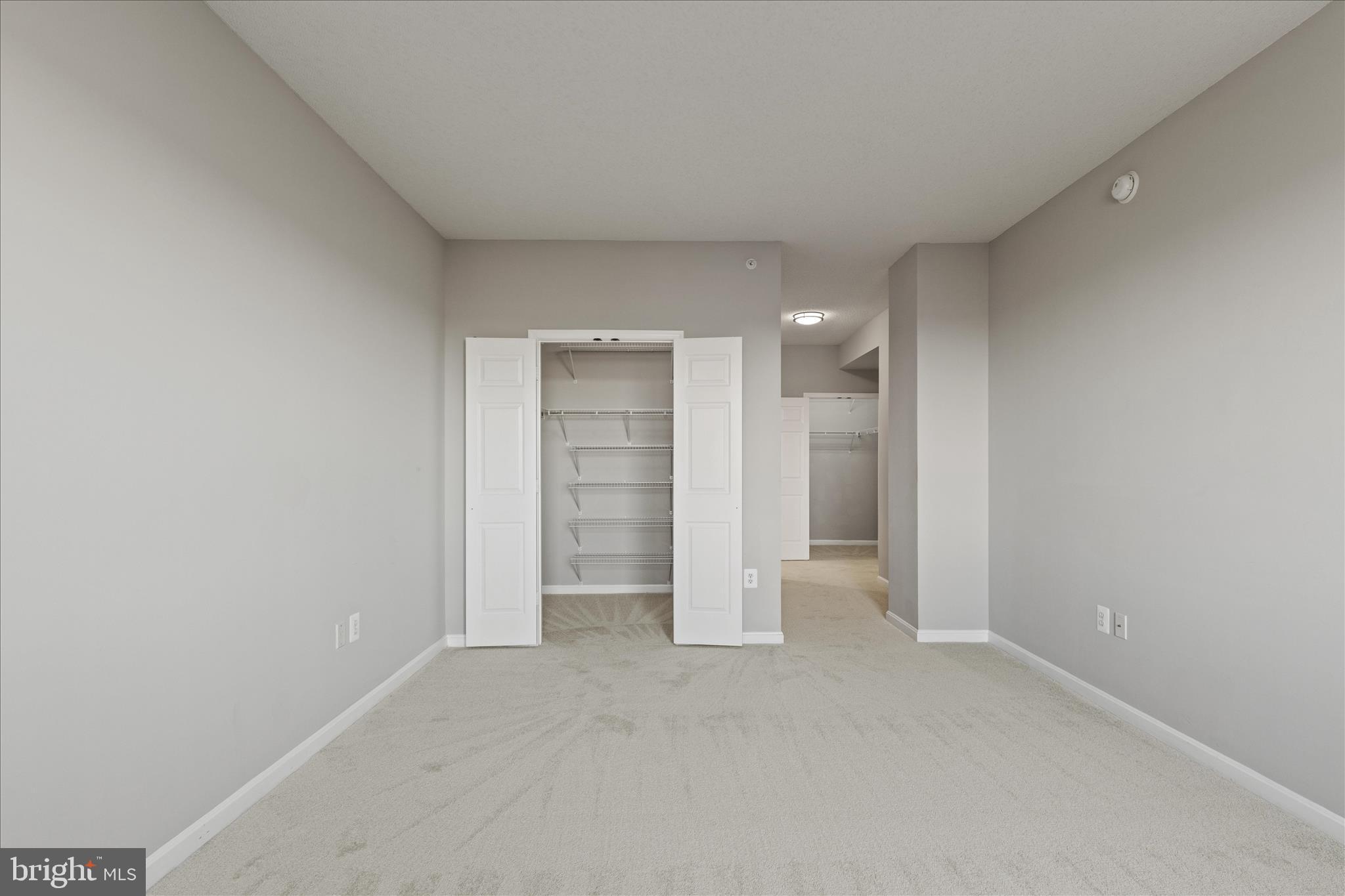 19355 Cypress Ridge Terrace, Unit 612 Leesburg, VA 20176 - Photo 35 of 65 a view of an empty room and a kitchen