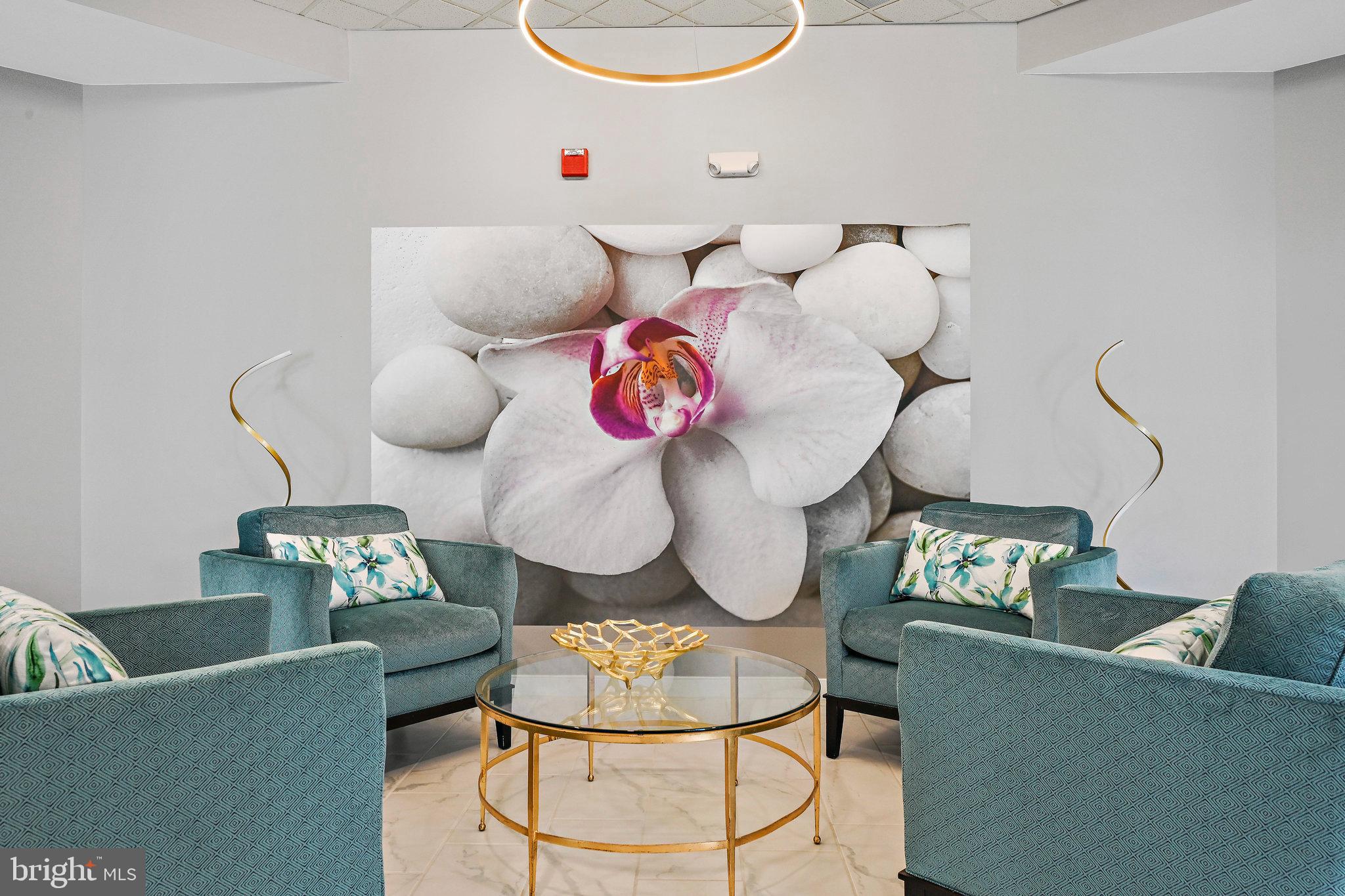 19355 Cypress Ridge Terrace, Unit 612 Leesburg, VA 20176 - Photo 50 of 65 a living room with furniture and couch