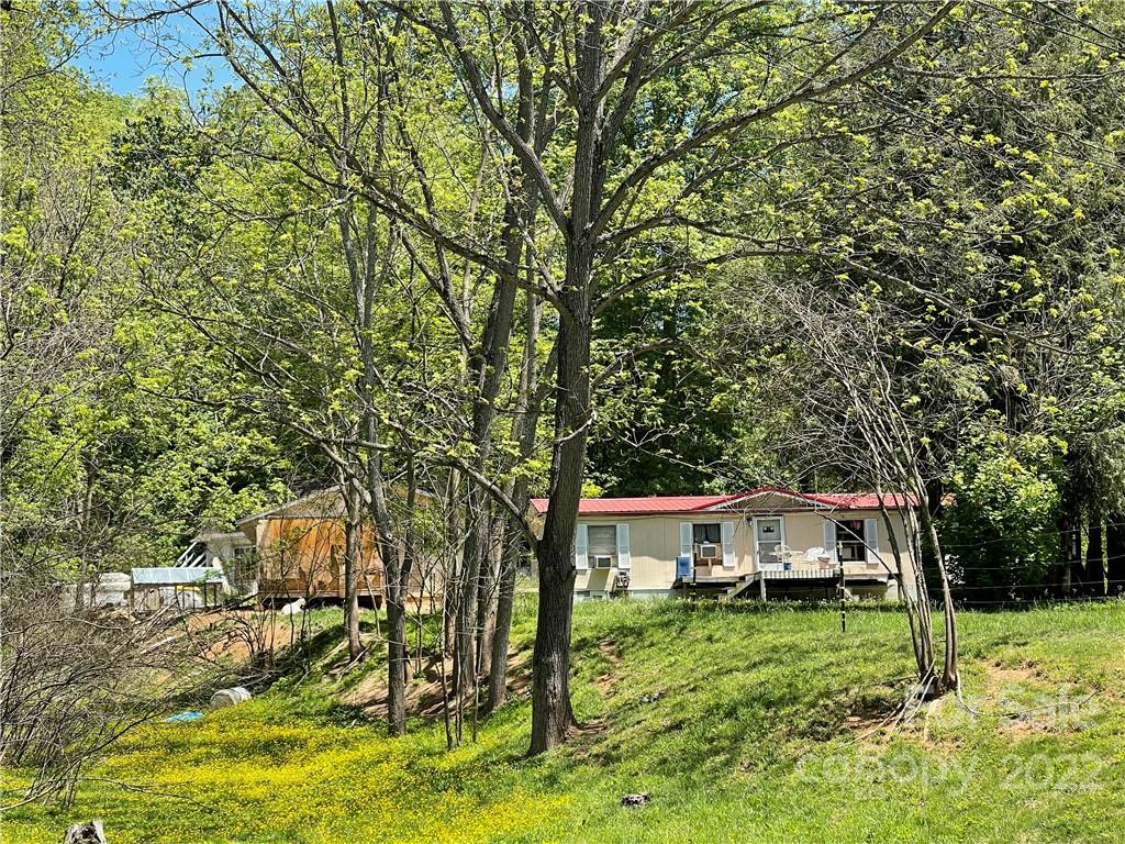 47 Little Creek Road Clyde, NC 28721 - Photo 2 of 2 a view of a house with yard and sitting area
