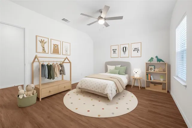 a bedroom with furniture and a wooden floor