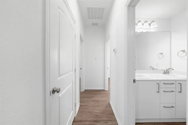 a bathroom with a sink a mirror and a shower