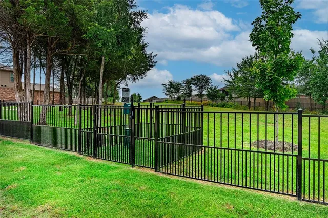 a view of a yard and a fountain