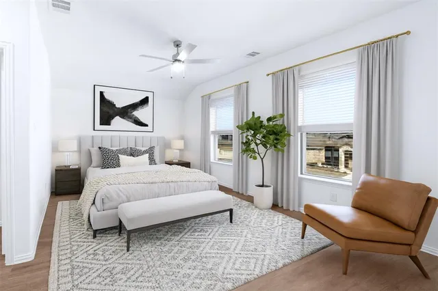 a bedroom with a large bed and a couch