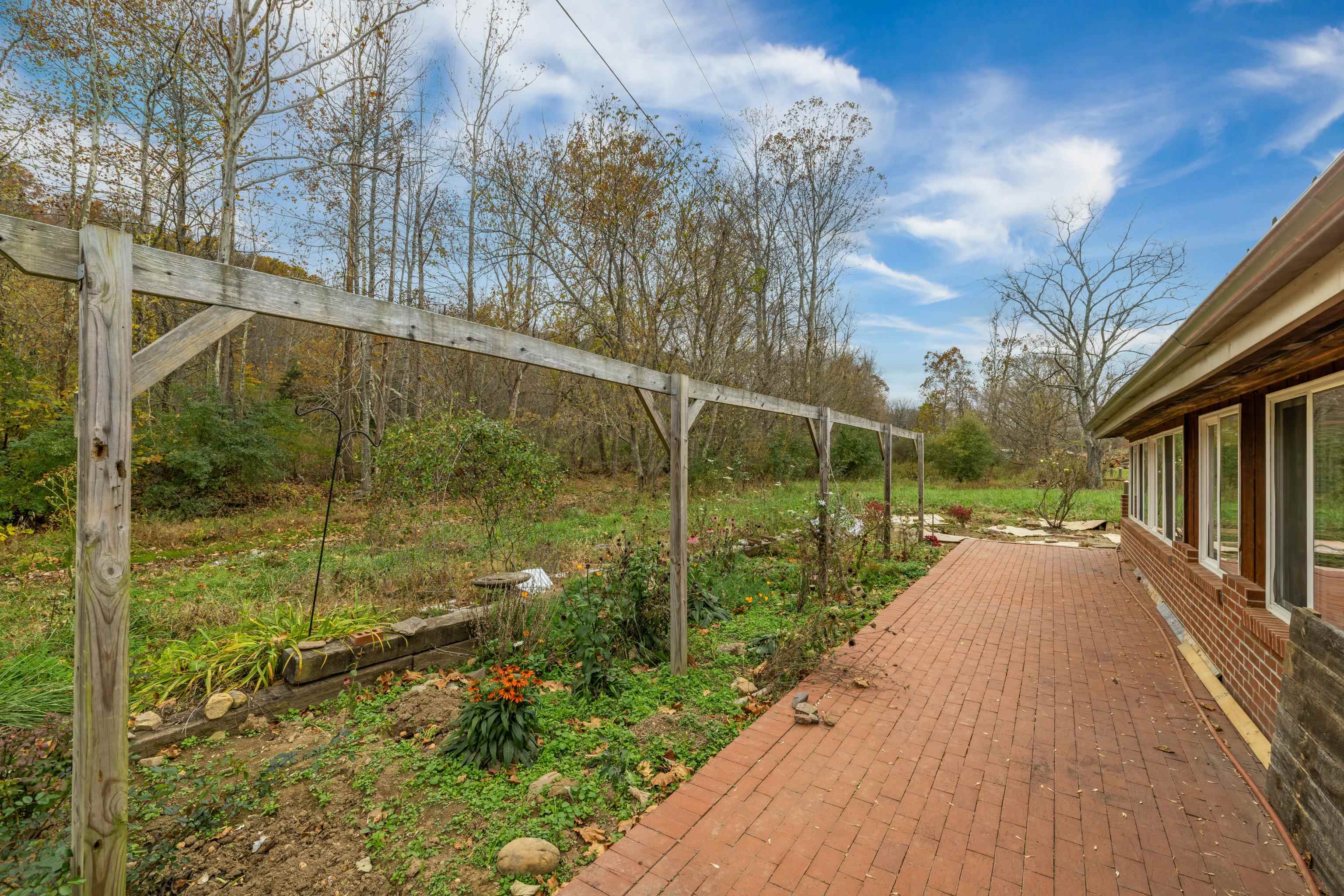 3441 West Midland Trail Lexington, VA 24450 - Photo 16 of 43 a view of a garden with a pathway