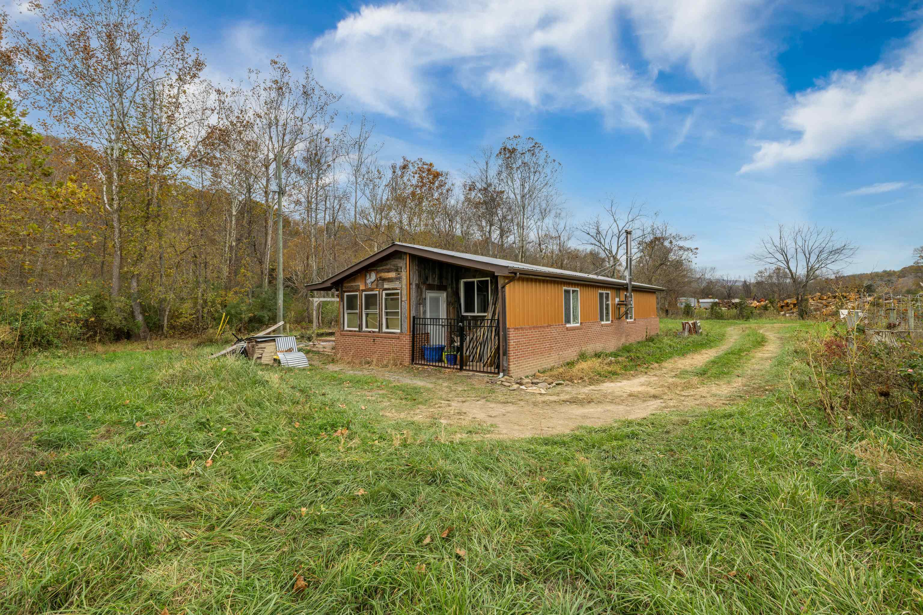 3441 West Midland Trail Lexington, VA 24450 - Photo 17 of 43 a backyard of a house with lots of green space