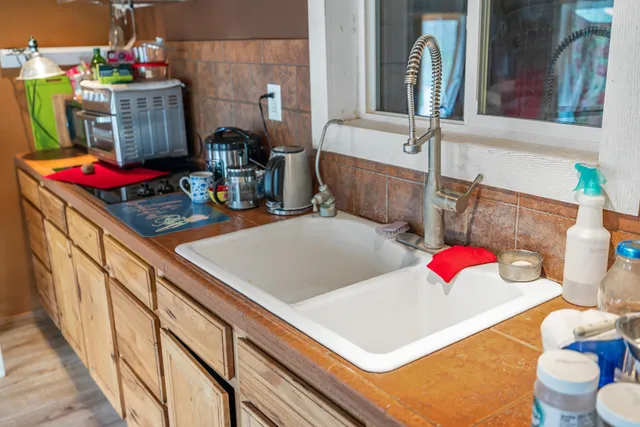 a bathroom with a sink and a mirror