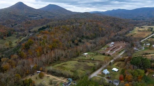 a view of a town with mountains in the background
